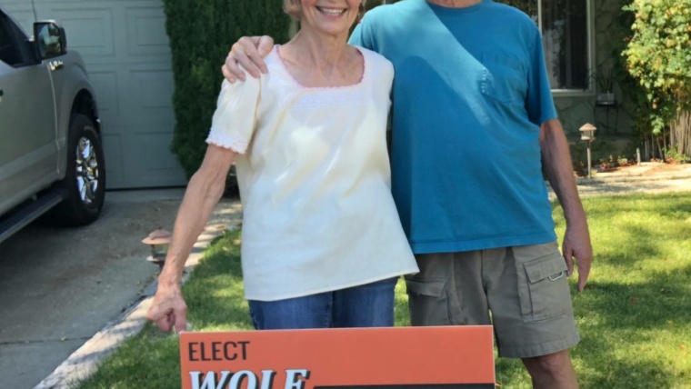 residents experience - couple holding a candidacy sign - Wolfgang Croskey - For Pittsburg Council
